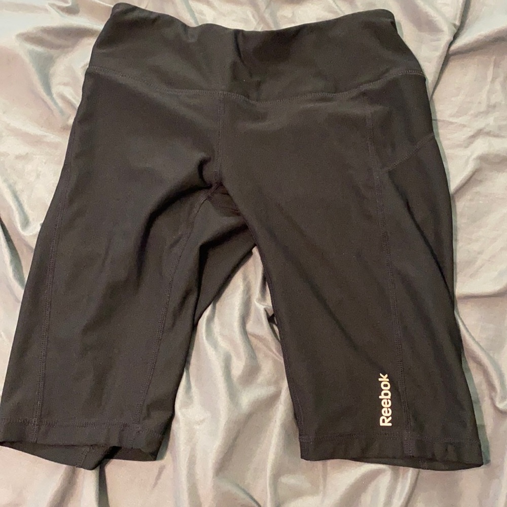 Reebok biker shorts.